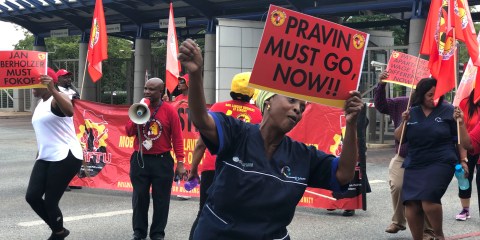 Unions call for Gordhan’s head in picket at Eskom’s Sandton offices