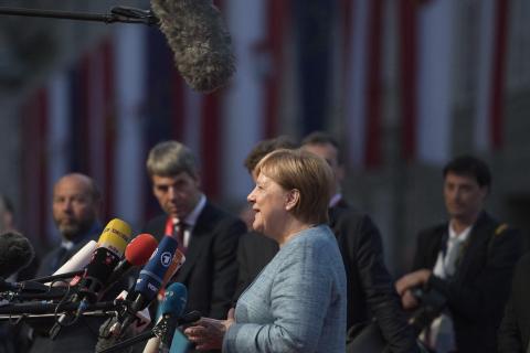 Merkel Steps Down as Party Leader as Election Setbacks Take Toll