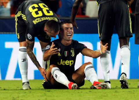 Ronaldo sent off but 10-man Juventus ease past Valencia