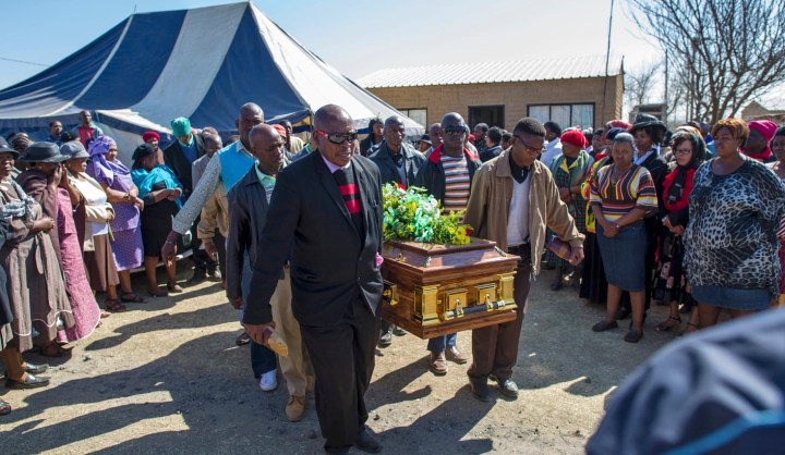 Far away from murder fields of Marikana, a funeral