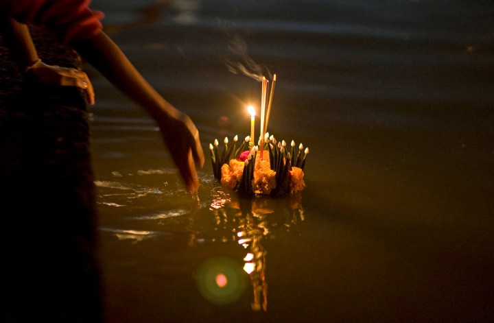 Floating lanterns are poignant symbols as Thailand battles floods