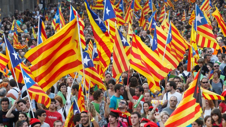 Vast crowds demand Catalan autonomy from crisis-hit Spain