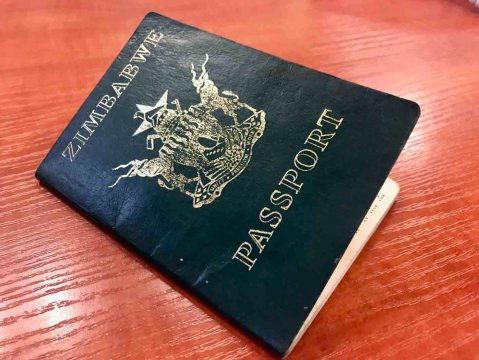 Asylum seekers say officials keep their passports until they buy tickets to Zimbabwe