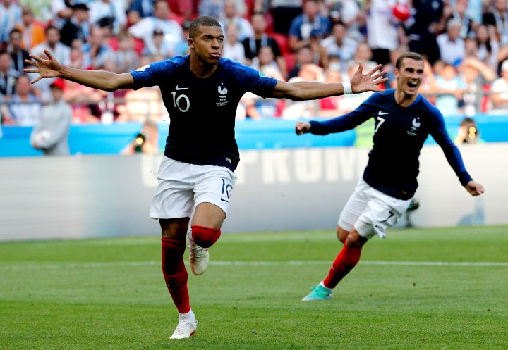 Kylian Mbappe of France (L) celebrates with teammate Antoine Griezmann of France scoring the 4-2 goal during the FIFA World Cup 2018 round of 16 soccer match between France and Argentina in Kazan, Russia, 30 June 2018.  EPA-EFE/SERGEY DOLZHENKO