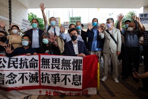 Hong Kong’s veteran pro-democracy activists defiant as they hear charges in court