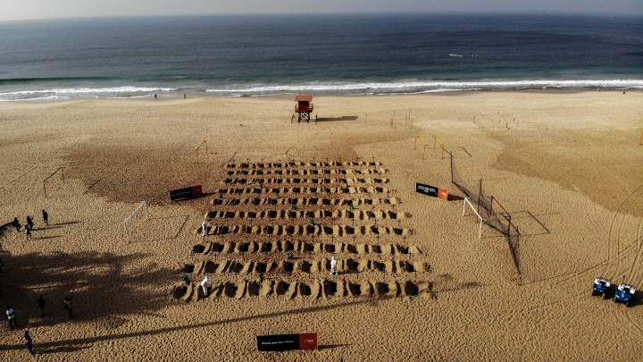Graves dug in Rio beach to protest handling of COVID-19 pandemic