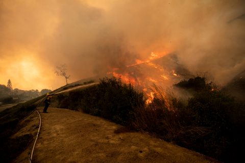 Wind-whipped Southern California wildfires prompt mass evacuations, injure 2 firefighters