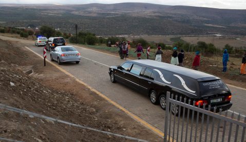 Police, workers exhume Mandela’s children