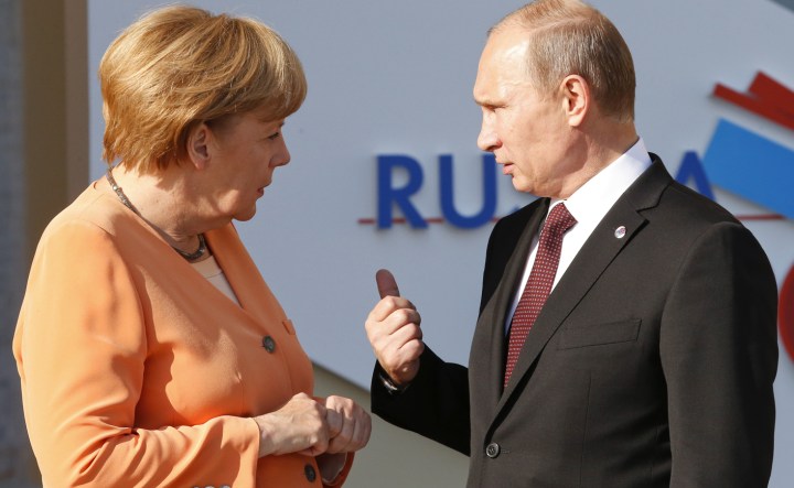 Merkel raps Putin as Russian forces tighten grip on Crimea